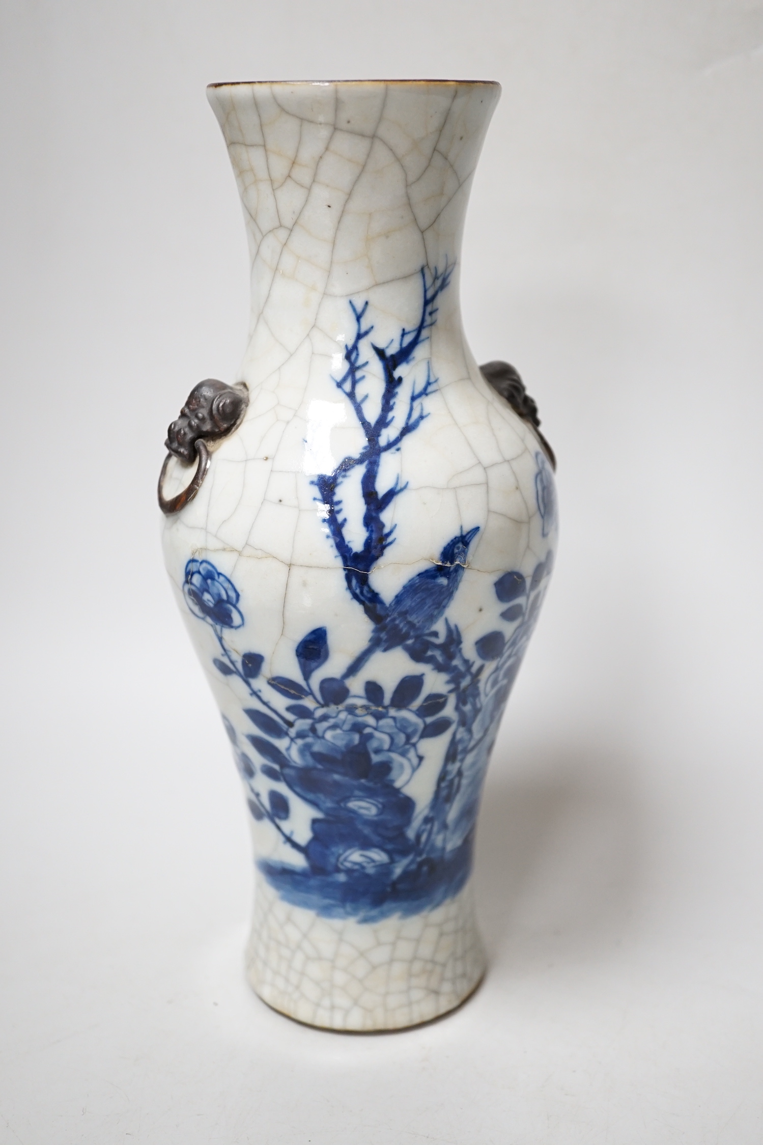 A Chinese blue and white bottle vase with figural decoration and two similar bowls, vase 17cm tall